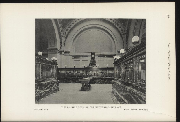 Schwarzes und weißes Foto des Banketts im National Park Bank, New York City, mit Tischen, Beleuchtung, einer Wanduhr und Text am unteren Rand.