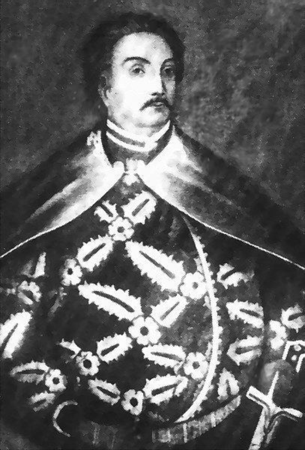 Schwarzes und weißes Foto von Papst Johannes Paul II. in Priesterrobe, trägt eine schwarze Robe mit weißem Kragen und Manschetten, Hände gefaltet, strenger Gesichtsausdruck, direkter Blick.